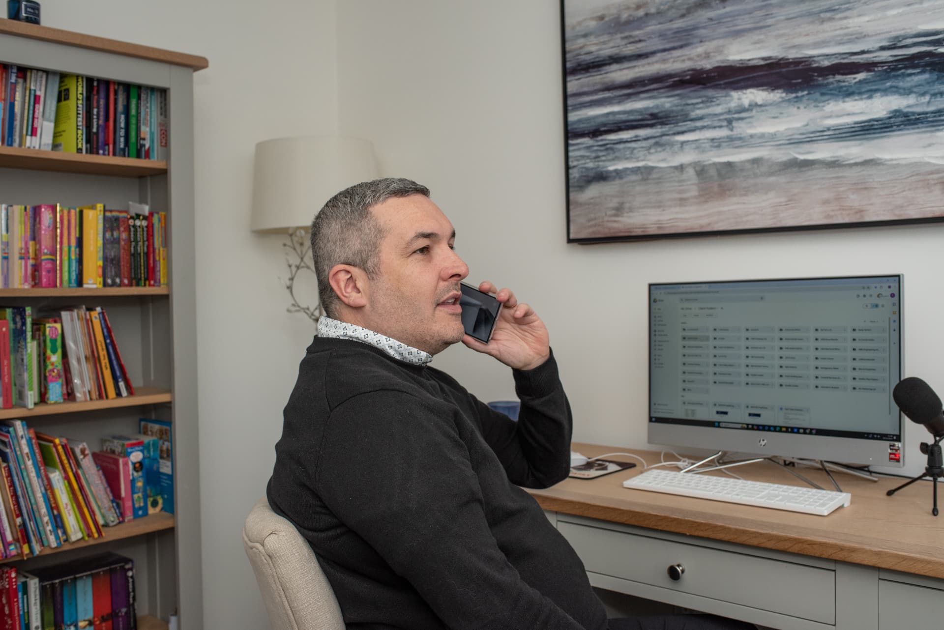 Chris discussing a business issue at his desk